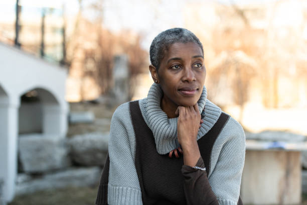 istock Contemplative elderly woman 1153753778