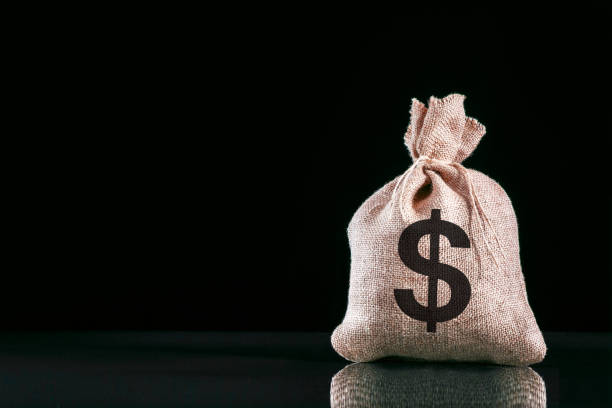 istock Money-bag with dollar symbol on black background with copy space. 1153755116