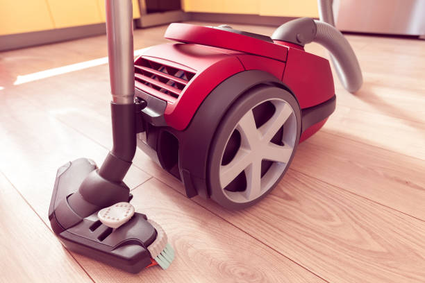 istock vacuum cleaner on a laminate in a kitchen 1153756452