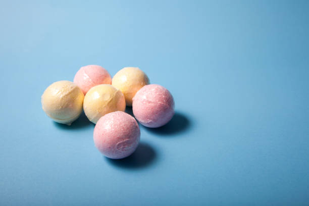 Triangle of pink and yellow bath bombs