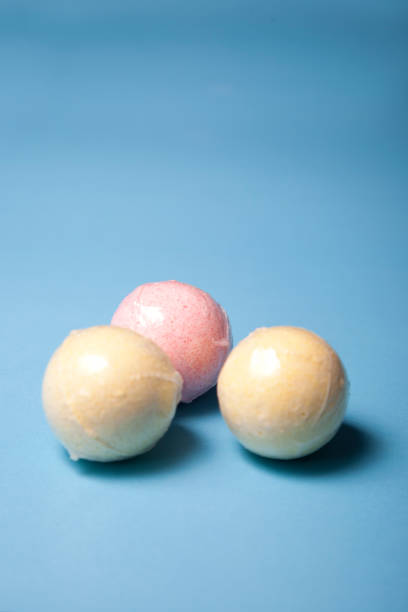 istock Three yellow and pink bath balls 1153756656