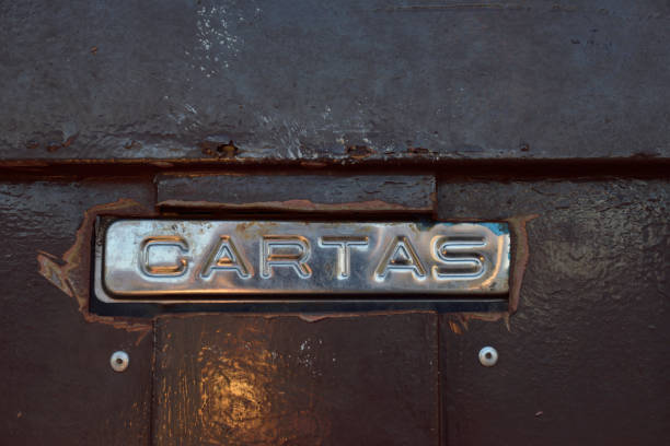 istock Old mailbox on a wooden browne door closeup view 1153758332
