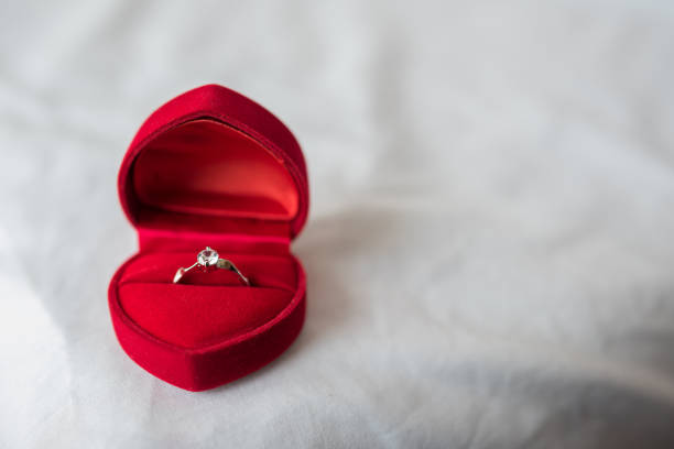 istock Wedding rings in a box on the bed 1153759773