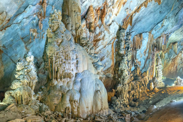 istock Cave-shaped limestone geological formations with beautiful stalactites and stalagmites 1153759878
