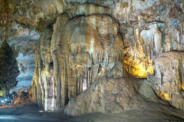 istock Cave-shaped limestone geological formations with beautiful stalactites and stalagmites 1153759905