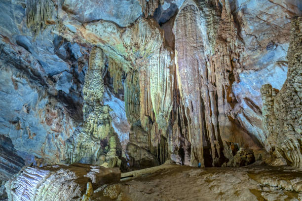 istock Cave-shaped limestone geological formations with beautiful stalactites and stalagmites 1153759918