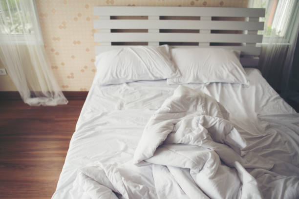 istock Crumpled bed in the bedroom 1153759931