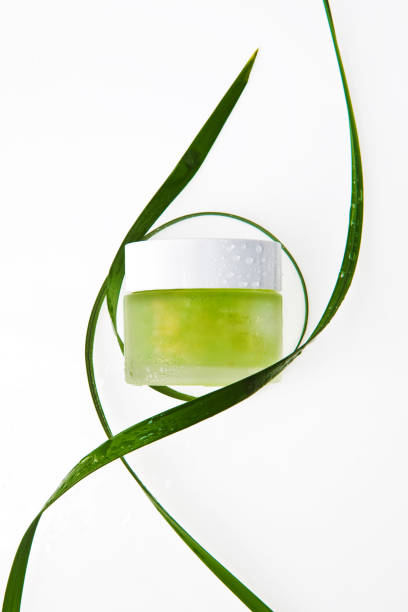 istock green gel cream and plants. 1153765134