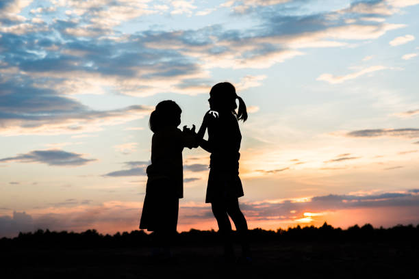 istock Silhouette of children playing 1153767122