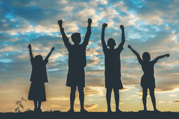 istock Silhouette of children playing 1153767145