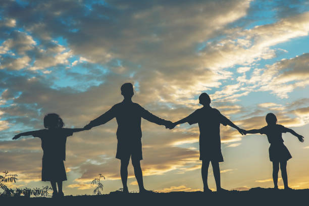 istock Silhouette of children playing 1153767665