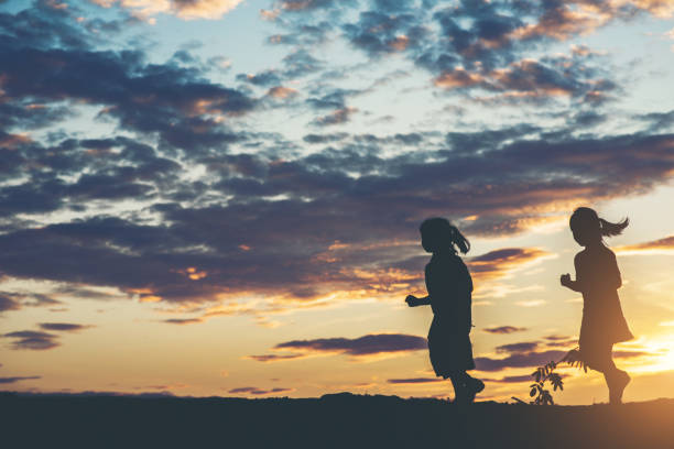 Silhouette of children playing