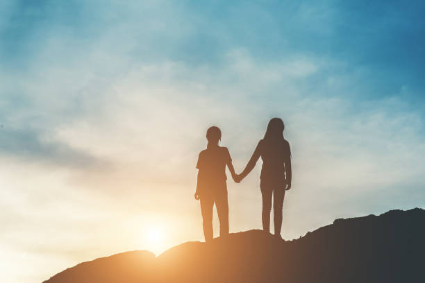 istock Silhouette of people happy time 1153767786