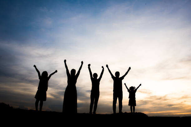 istock Silhouette of people happy time 1153767893