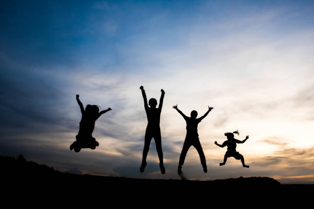 istock Silhouette of people happy time 1153767896
