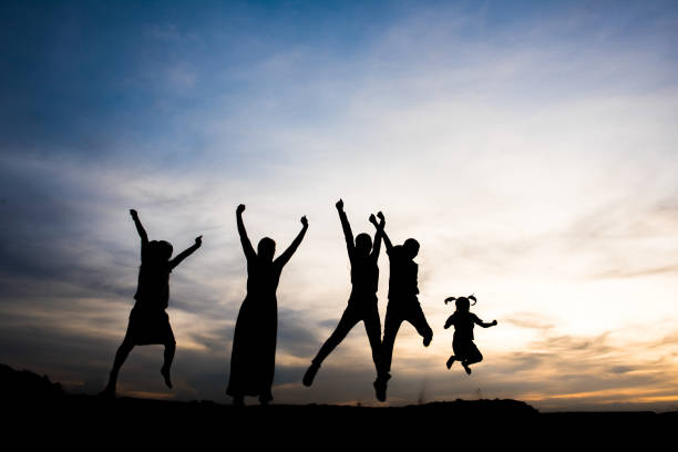 istock Silhouette of people happy time 1153767909
