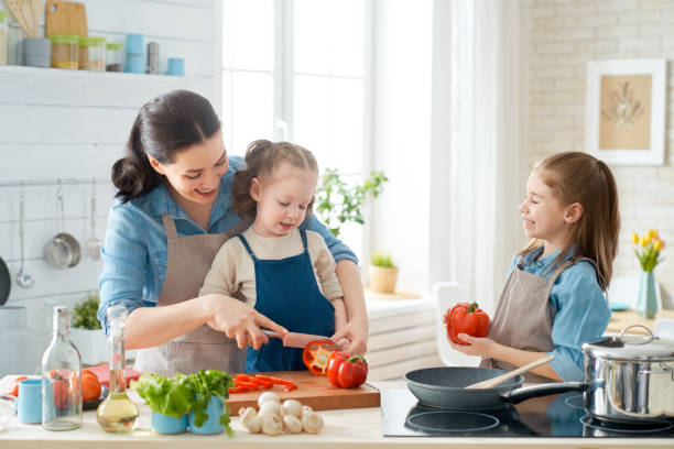 istock Happy family in the kitchen. 1153773395