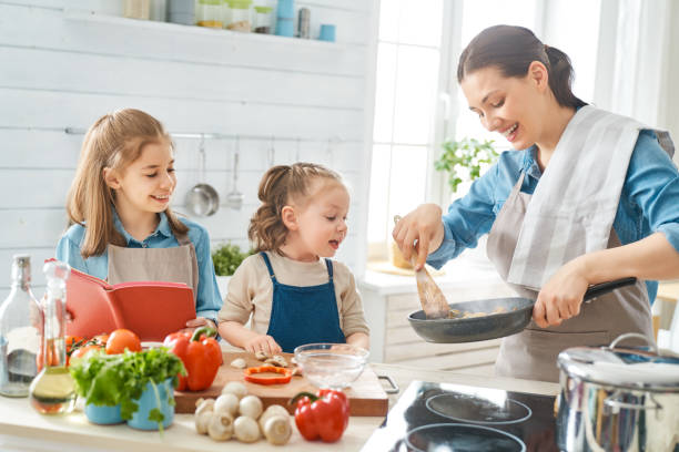 istock Happy family in the kitchen. 1153773398