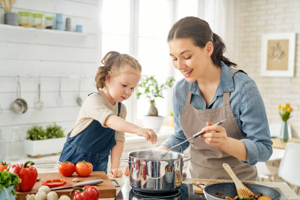 istock Happy family in the kitchen. 1153773399