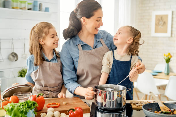 istock Happy family in the kitchen. 1153773411