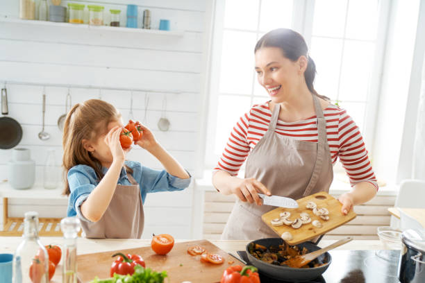 istock Happy family in the kitchen. 1153773412