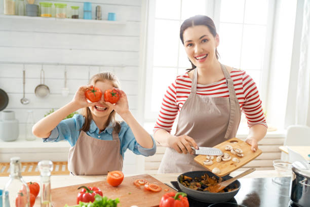 istock Happy family in the kitchen. 1153773426
