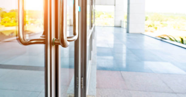 Glass door of the office building Glass door of the office building. bank entrance stock pictures, royalty-free photos & images