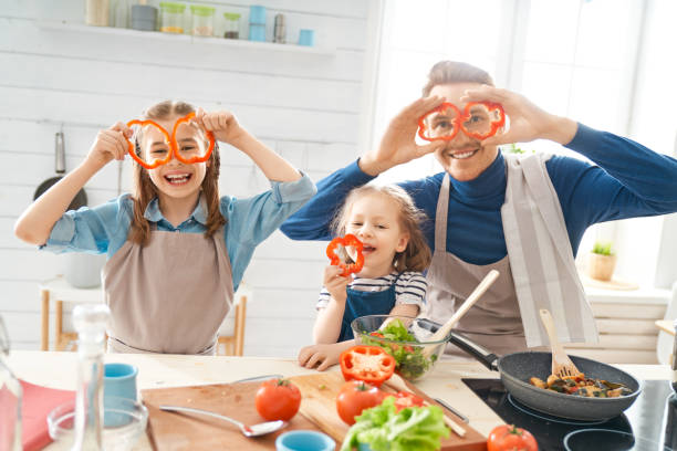 istock Happy family in the kitchen. 1153776500