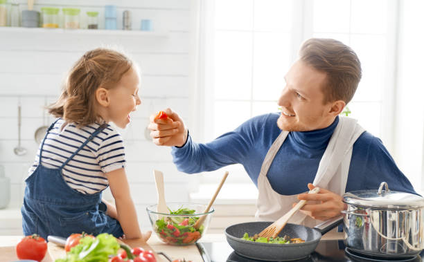 istock Happy family in the kitchen. 1153776501