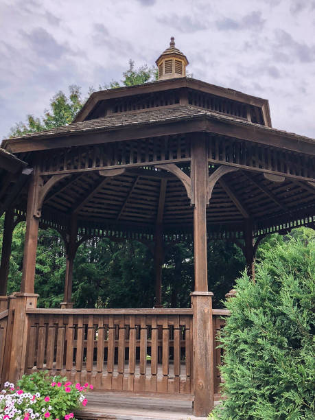 istock Brown wooden gazebo in park 1153776816