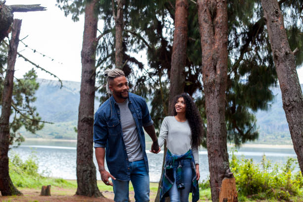 istock Couple walking through the woods 1153776928