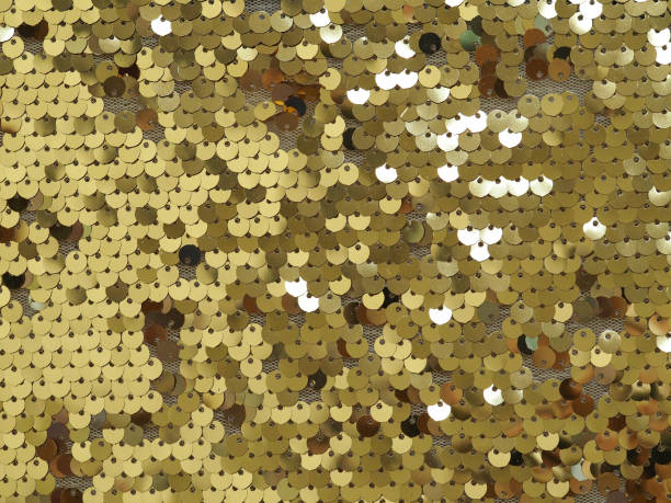 istock Background of gold shiny sequins. Close up. 1153777476
