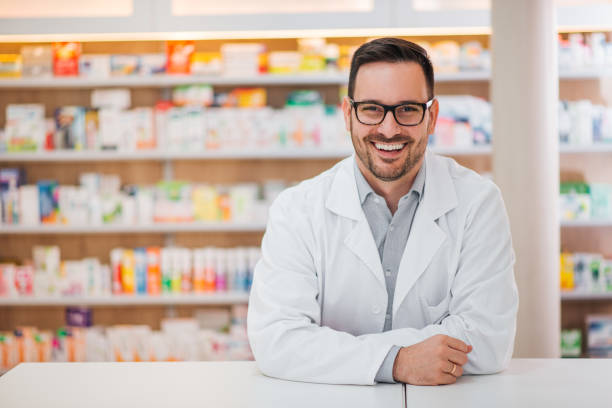 Smiling portrait of a handsome pharmacist. Smiling portrait of a handsome pharmacist. pharmacist stock pictures, royalty-free photos & images