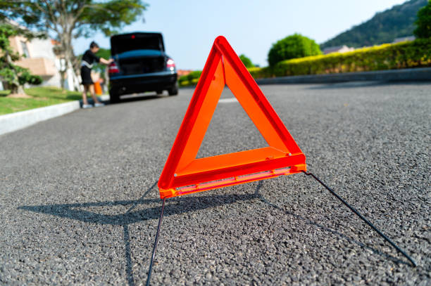 istock Hazard sign for car breakdown on rural road 1153782533