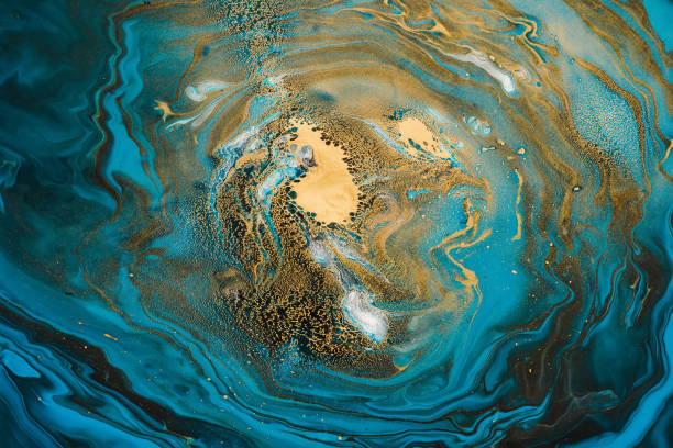 istock Acrylic Fluid Art. Blue turquoise waves and gold spots inclusions. Abstract space background or texture 1153789007