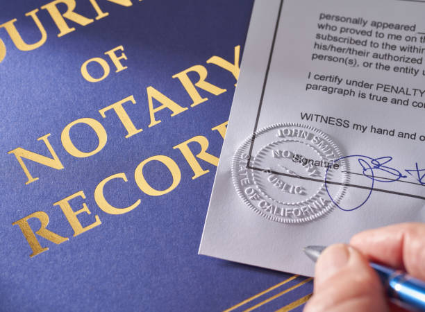 Notary Public: Seal embossed on document with pen and journal Notary Public: Seal embossed on document with pen notary photos stock pictures, royalty-free photos & images