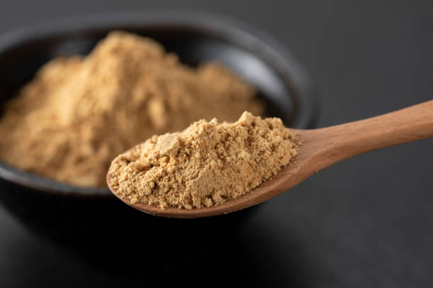 istock Soybean flour on black background 1153794702