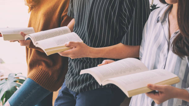 istock people sitting and enjoyed reading books together 1153796165