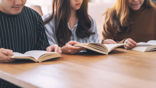 istock people sitting and enjoyed reading books together 1153796178