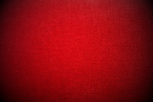 Close-up of red velvet sofa - vignetting effect