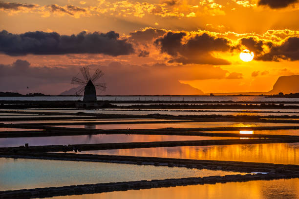 istock Marsala salt pans at sunset, Sicily, Italy 1153797020