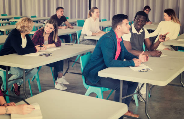 istock Adult students discussing lesson 1153797631
