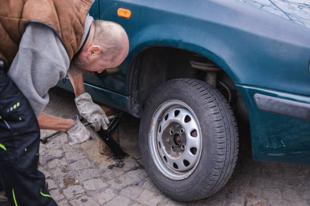 istock DIY vintage car wheel change 1153798961