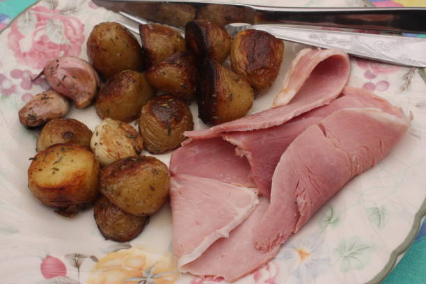 Slice of ham served with hash browns