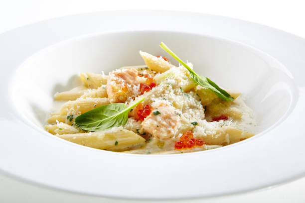 istock Fish Penne Pasta Al Dente with Salmon Isolated on White Background 1153800131