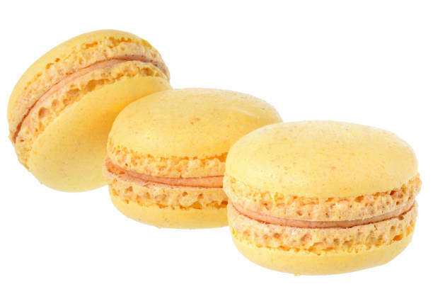 istock Yellow peach macaroon close up isolated 1153800140