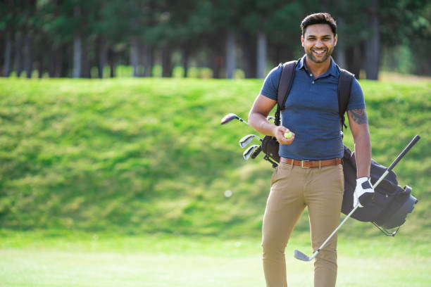istock Male golfer standing on golf course 1153802270