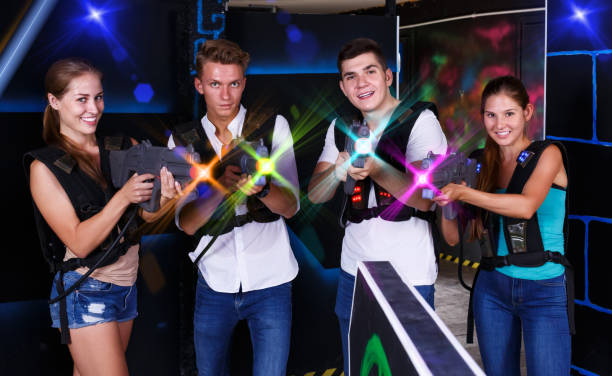 istock Young people posing with laser pistols 1153803653