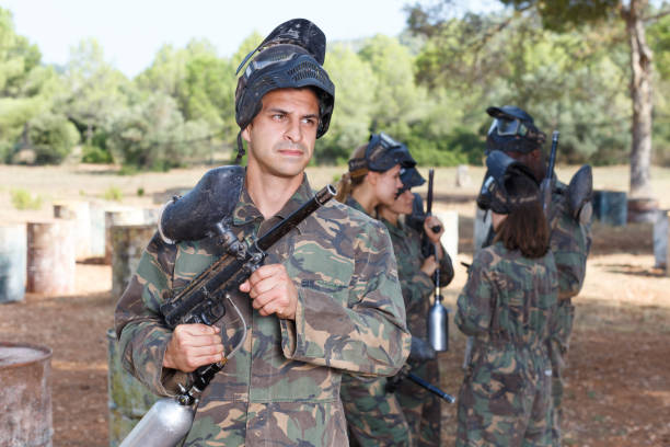 istock Male paintball player ready for game 1153803990