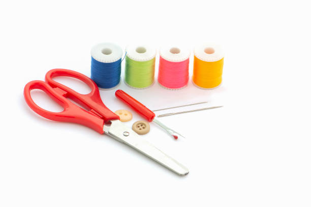istock Multi-colored thread,Scissors, sewing needle, tape measure,thread picker clothing repair concept. 1153805705